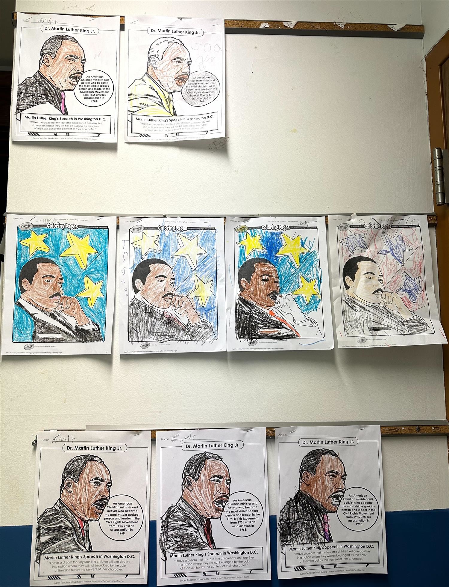 Nine coloring pages with pictures of Dr. Martin Luther King, Jr., displayed on a wall.